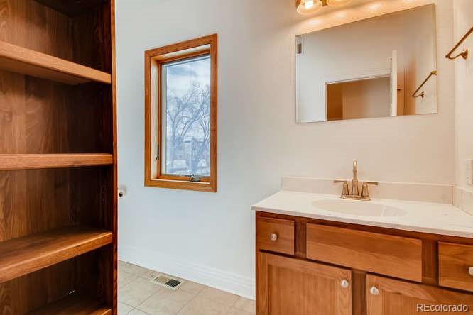 380 County Road Louisville, CO 80027 - Photo 16 of 28 a bathroom with a sink and a mirror