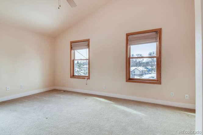 380 County Road Louisville, CO 80027 - Photo 18 of 28 an empty room with windows