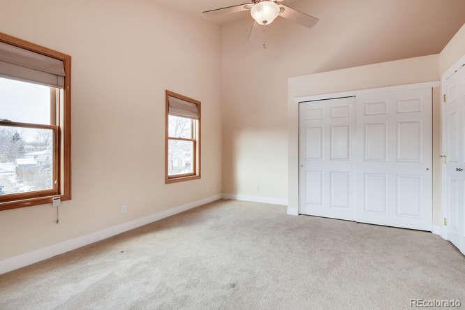 380 County Road Louisville, CO 80027 - Photo 21 of 28 an empty room with a window