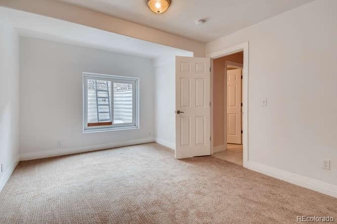 380 County Road Louisville, CO 80027 - Photo 22 of 28 an empty room with windows