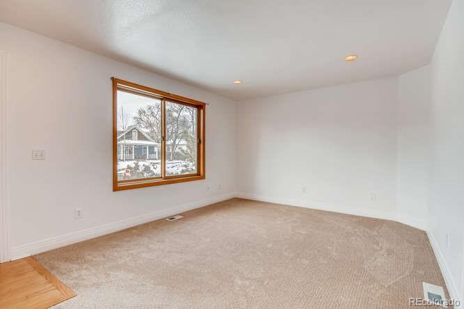 380 County Road Louisville, CO 80027 - Photo 4 of 28 an empty room with windows