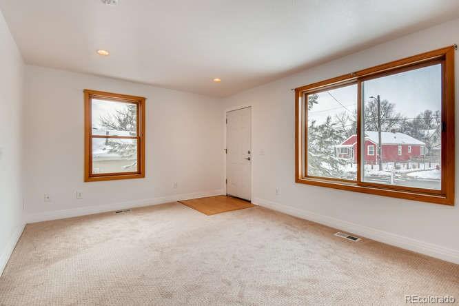 380 County Road Louisville, CO 80027 - Photo 5 of 28 an empty room with windows