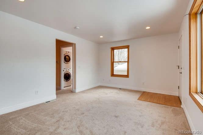 380 County Road Louisville, CO 80027 - Photo 6 of 28 an empty room with windows and closet