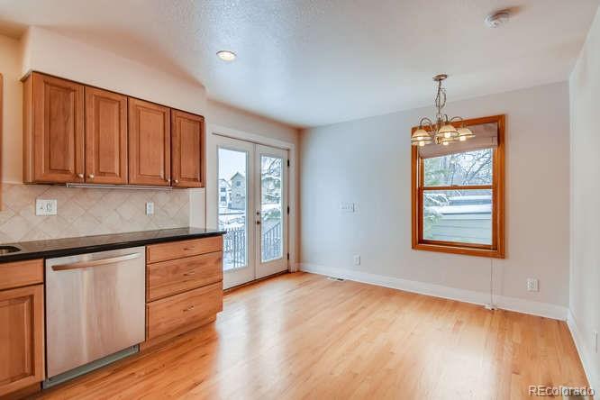 380 County Road Louisville, CO 80027 - Photo 10 of 28 a kitchen that has a lot of cabinets and wooden floor