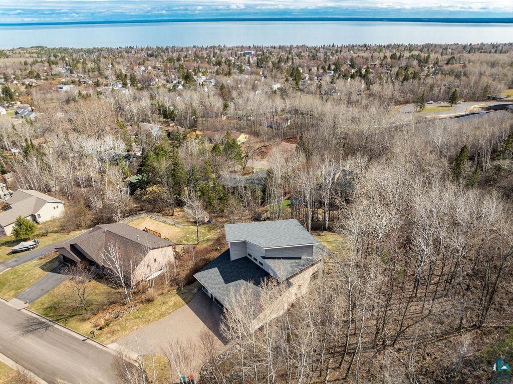 4856 Kingston Street Duluth, MN 55804 - Photo 64 of 88 Aerial perspective showcasing a property surrounded by mature trees and verdant landscaping