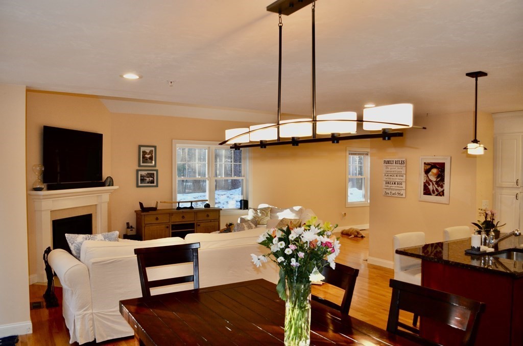 3 Trail Ridge Way, Unit D Harvard, MA 01451 - Photo 11 of 41 a living room with furniture fireplace and a flat screen tv