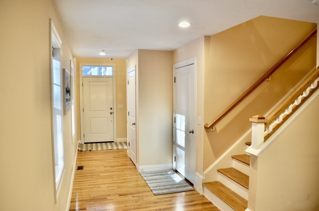 3 Trail Ridge Way, Unit D Harvard, MA 01451 - Photo 12 of 41 a view of a hallway with wooden floor and staircase