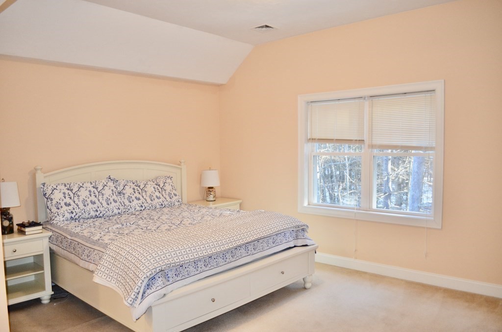 3 Trail Ridge Way, Unit D Harvard, MA 01451 - Photo 22 of 41 a bedroom with a large bed and a window