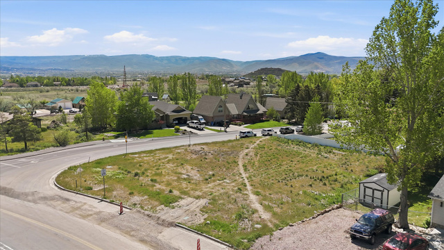 123 West 1050th North, Unit 41 Midway, UT 84049 - Photo 12 of 22 Elevated parcel featuring natural ground cover, distant mountain ranges, and a paved road frontage