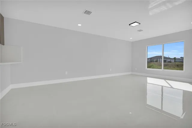 a view of an empty room with a window