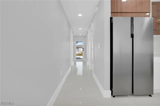 a bathroom with a bathtub sink and mirror