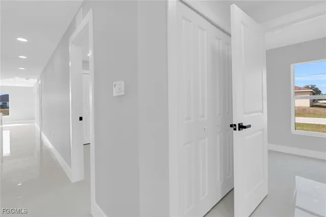 a view of a kitchen with a refrigerator and a sink
