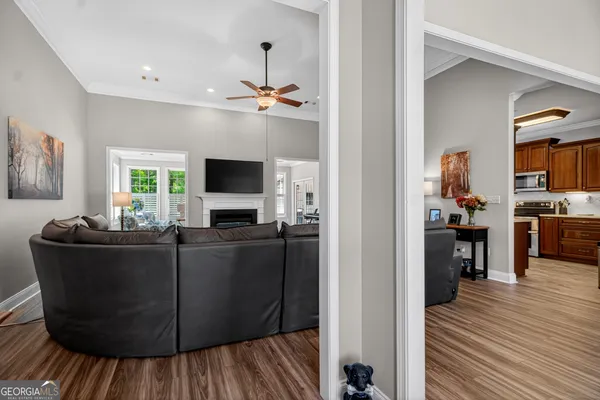 a living room with furniture and a flat screen tv