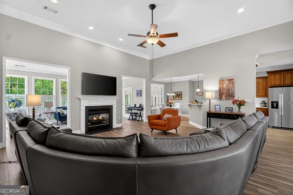 a living room with furniture and a fireplace