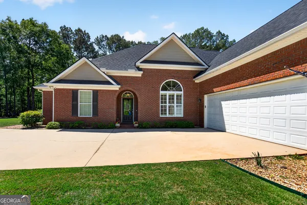 a front view of a house with a yard