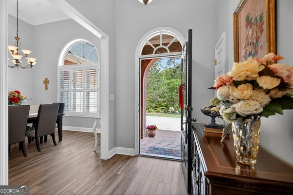a view of a livingroom with furniture window and wooden floor