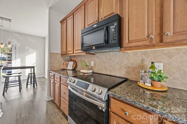 a view of a livingroom with furniture and wooden floor