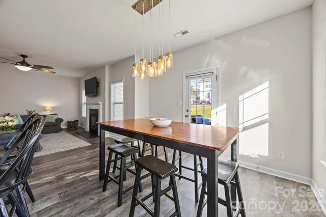 a bathroom with a bathtub sink and mirror