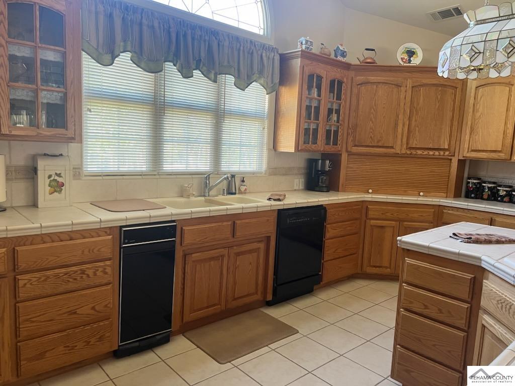 19740 Reeds Creek Road Red Bluff, CA 96080 - Photo 24 of 51 a kitchen with a sink stove and cabinets