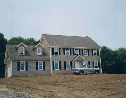 277 Bioski Road Middlebury, CT 06762 - Photo 1 of 1 a front view of a house with a garden and yard
