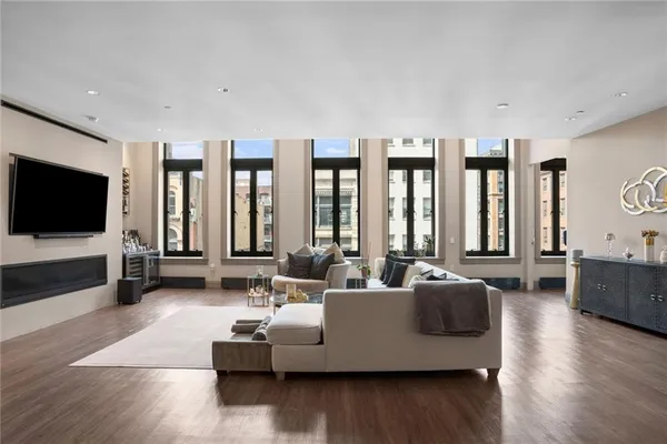 a living room with furniture and a flat screen tv