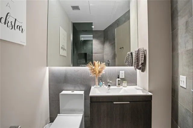 a bathroom with a sink and mirror