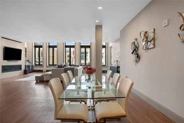 a view of a dining room with furniture and wooden floor