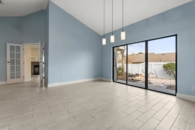 a view of an empty room with a balcony