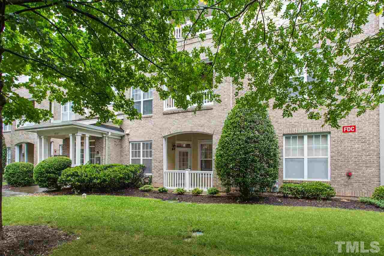 3151 Hemlock Forest Circle, Unit 102 Raleigh, NC 27612 - Photo 2 of 26 a front view of a house with a garden