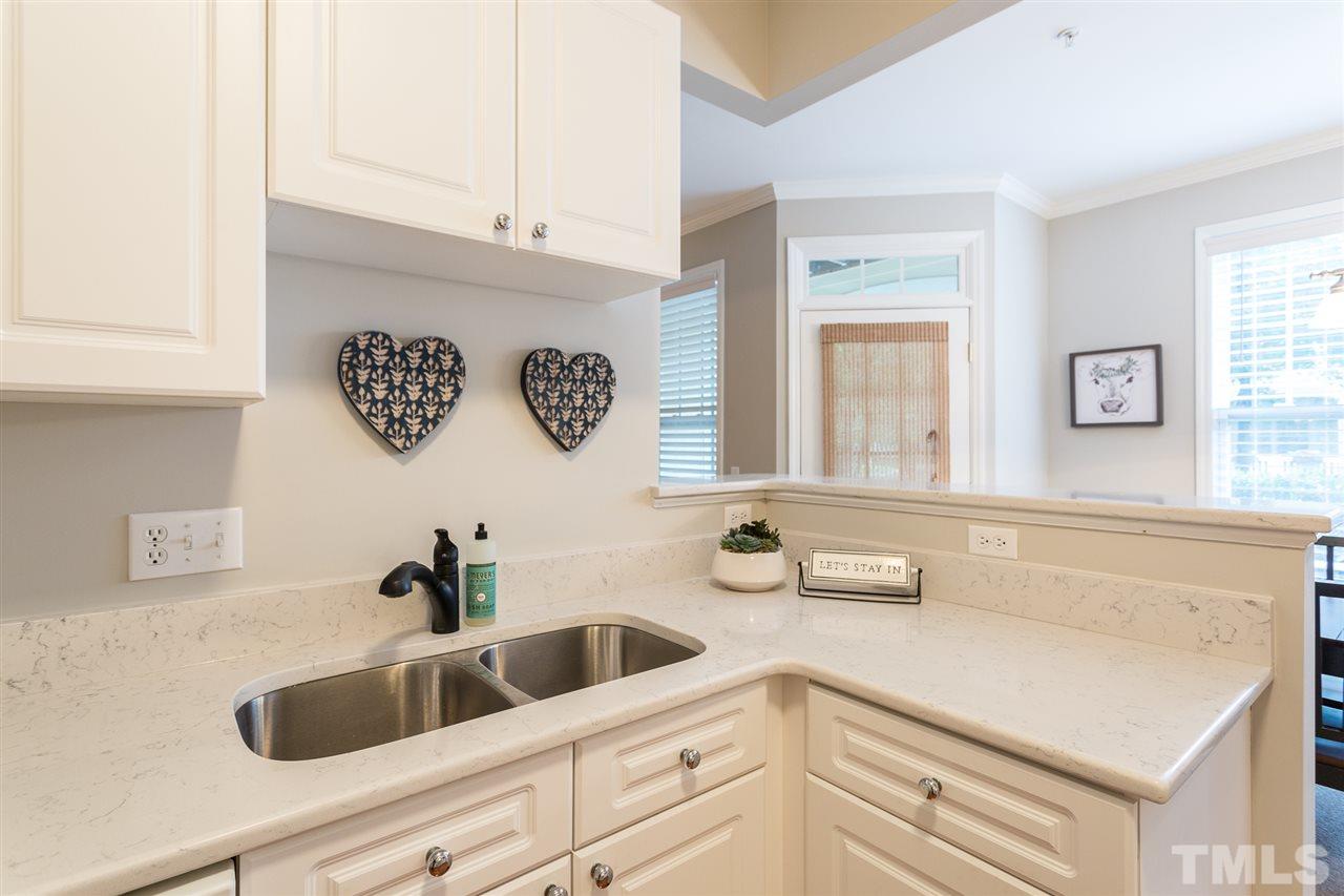 3151 Hemlock Forest Circle, Unit 102 Raleigh, NC 27612 - Photo 18 of 26 a bathroom with a sink and a bathtub