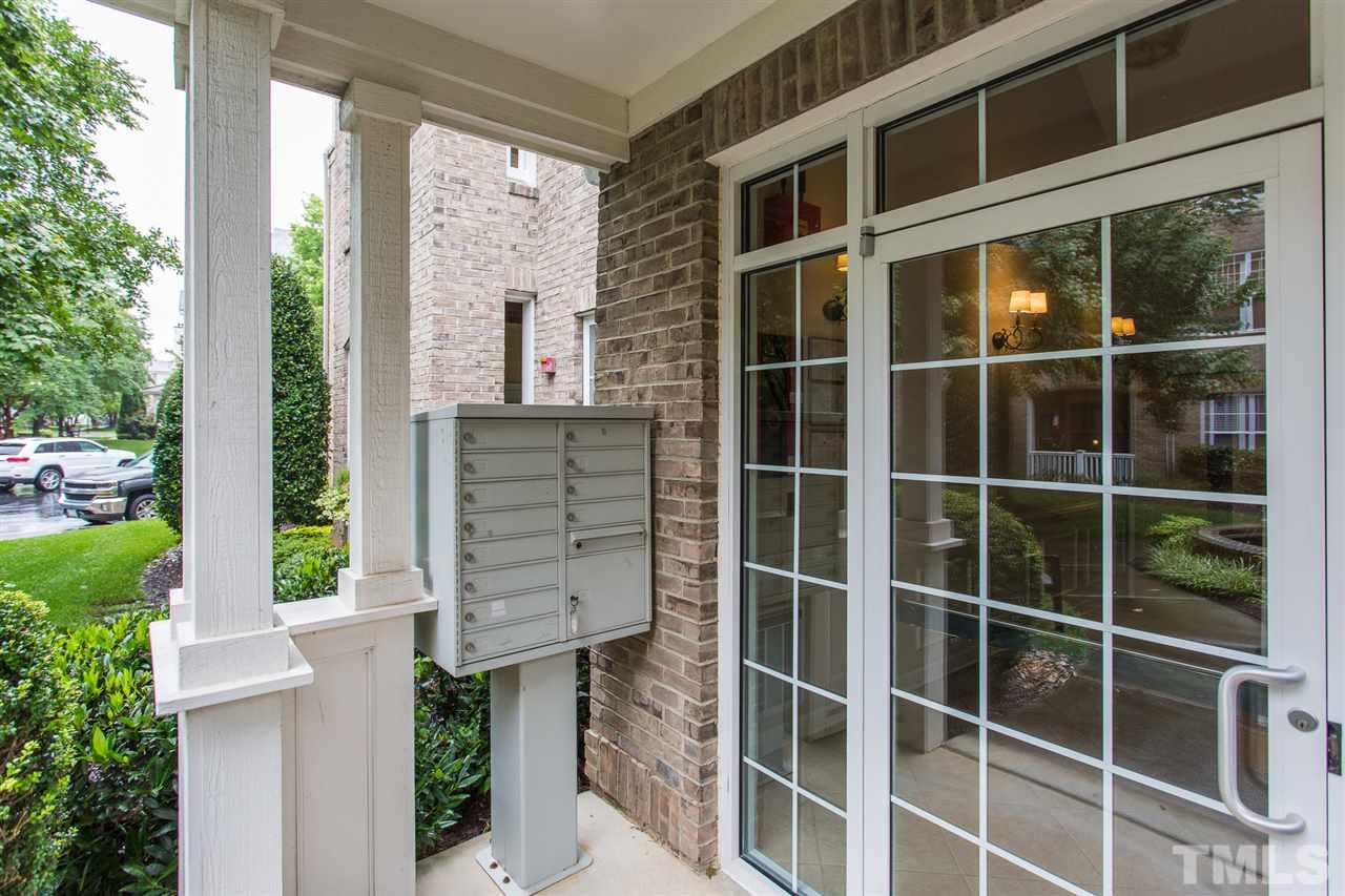 3151 Hemlock Forest Circle, Unit 102 Raleigh, NC 27612 - Photo 5 of 26 a front view of a house with a garden