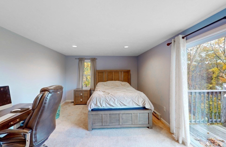 5 B Swan Avenue Worcester, MA 01602 - Photo 7 of 18 a bedroom with a bed and wooden floor