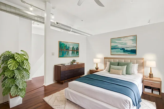 a bedroom with bed and a window