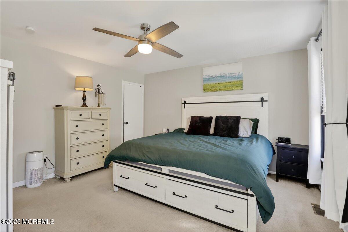 73 Rita Lane Jackson, NJ 08527 - Photo 16 of 32 a bedroom with a bed and a dresser