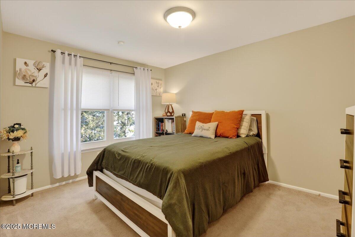 73 Rita Lane Jackson, NJ 08527 - Photo 20 of 32 a bedroom with a bed and a window