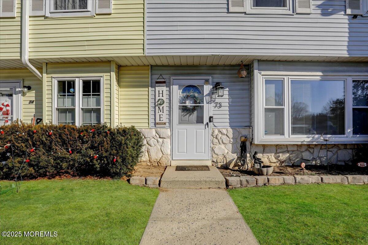 73 Rita Lane Jackson, NJ 08527 - Photo 2 of 32 a front view of a house with a garden