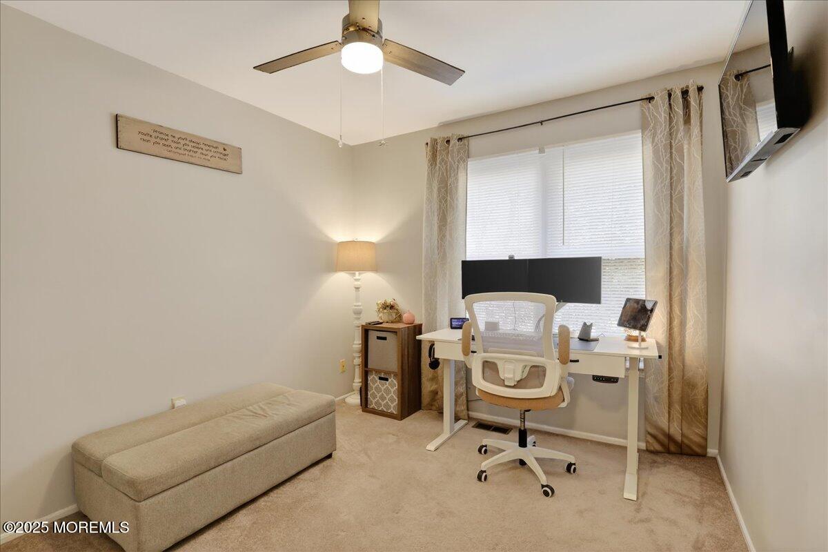 73 Rita Lane Jackson, NJ 08527 - Photo 21 of 32 a work room with furniture and a chandelier