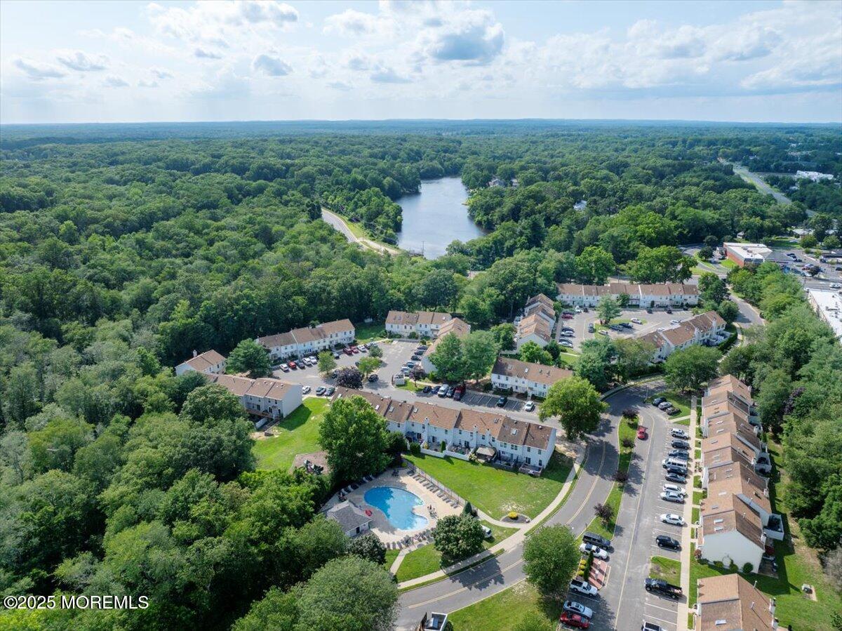 73 Rita Lane Jackson, NJ 08527 - Photo 27 of 32 an aerial view of a house with a garden and lake view