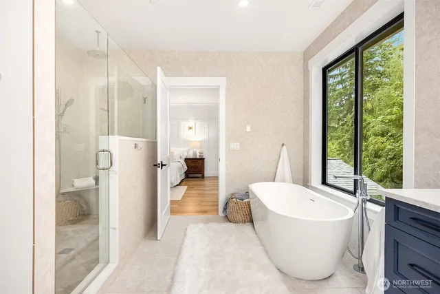 a bathroom with a tub toilet and sink