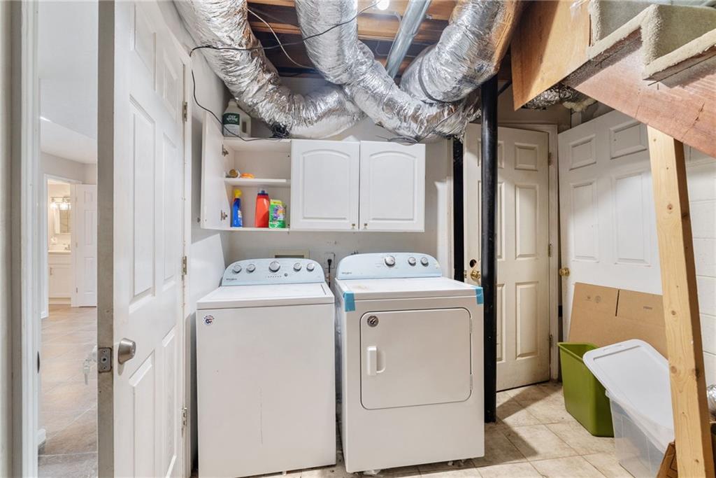 1449 Southland Vista Court Northeast, Unit B Atlanta, GA 30329 - Photo 13 of 26 a utility room with dryer and washer