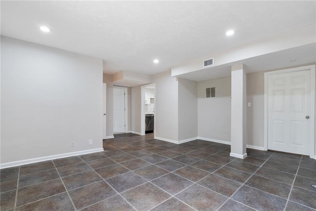 1449 Southland Vista Court Northeast, Unit B Atlanta, GA 30329 - Photo 5 of 26 a view of an empty room with a window