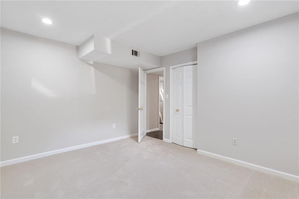 1449 Southland Vista Court Northeast, Unit B Atlanta, GA 30329 - Photo 8 of 26 a view of an empty room