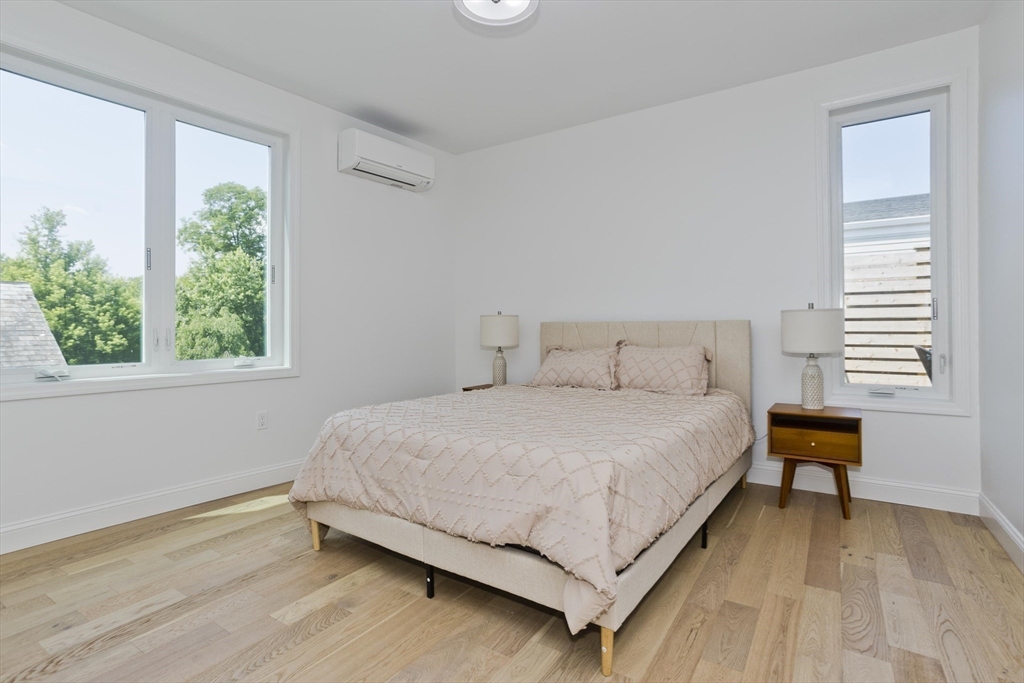 107 Williams Street, Unit 3C Northampton, MA 01060 - Photo 17 of 19 a bedroom with a bed and a window