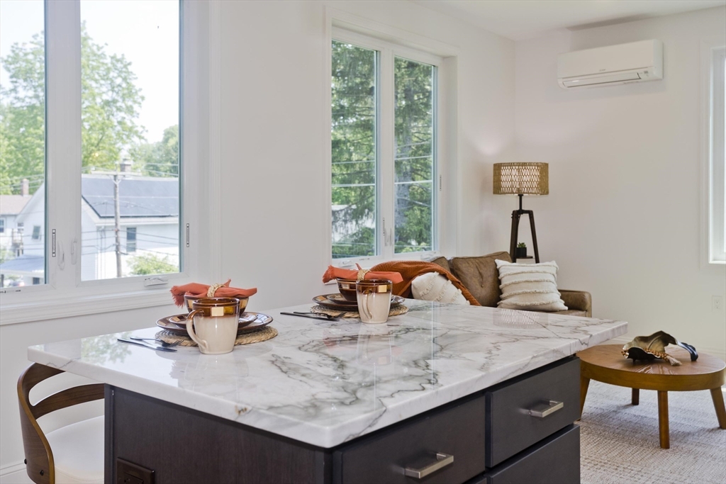 107 Williams Street, Unit 3C Northampton, MA 01060 - Photo 5 of 19 a kitchen with a sink a stove and a window