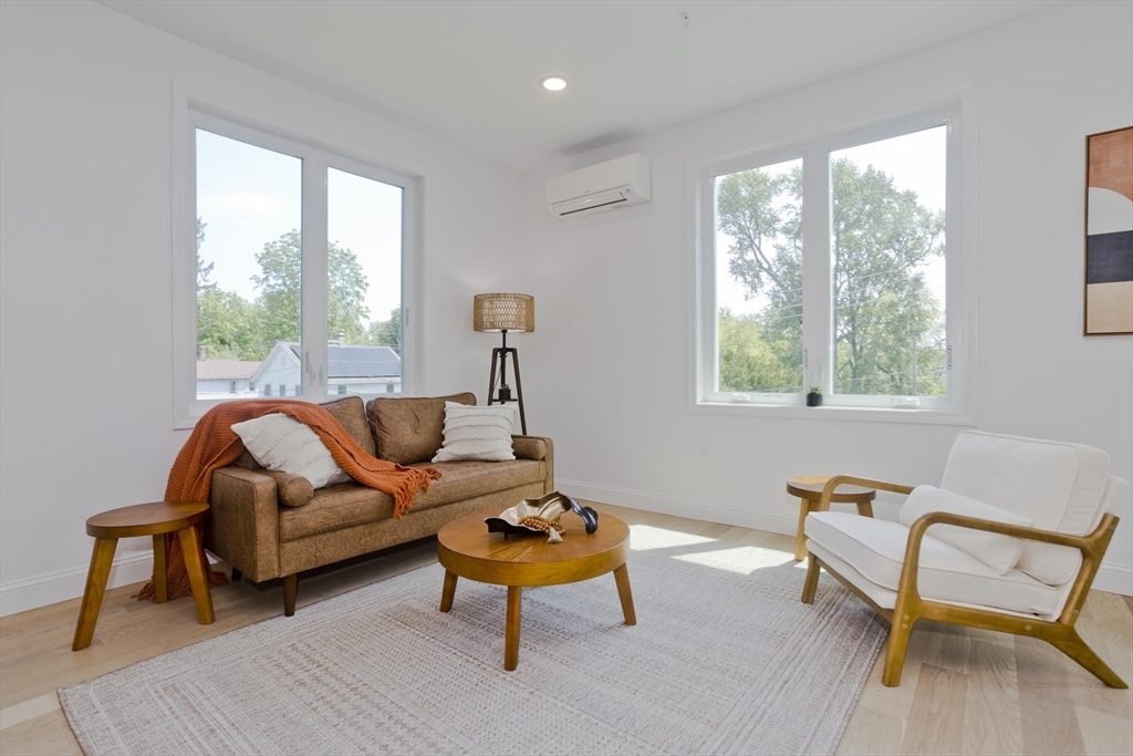 107 Williams Street, Unit 3C Northampton, MA 01060 - Photo 9 of 19 a living room with furniture and a window