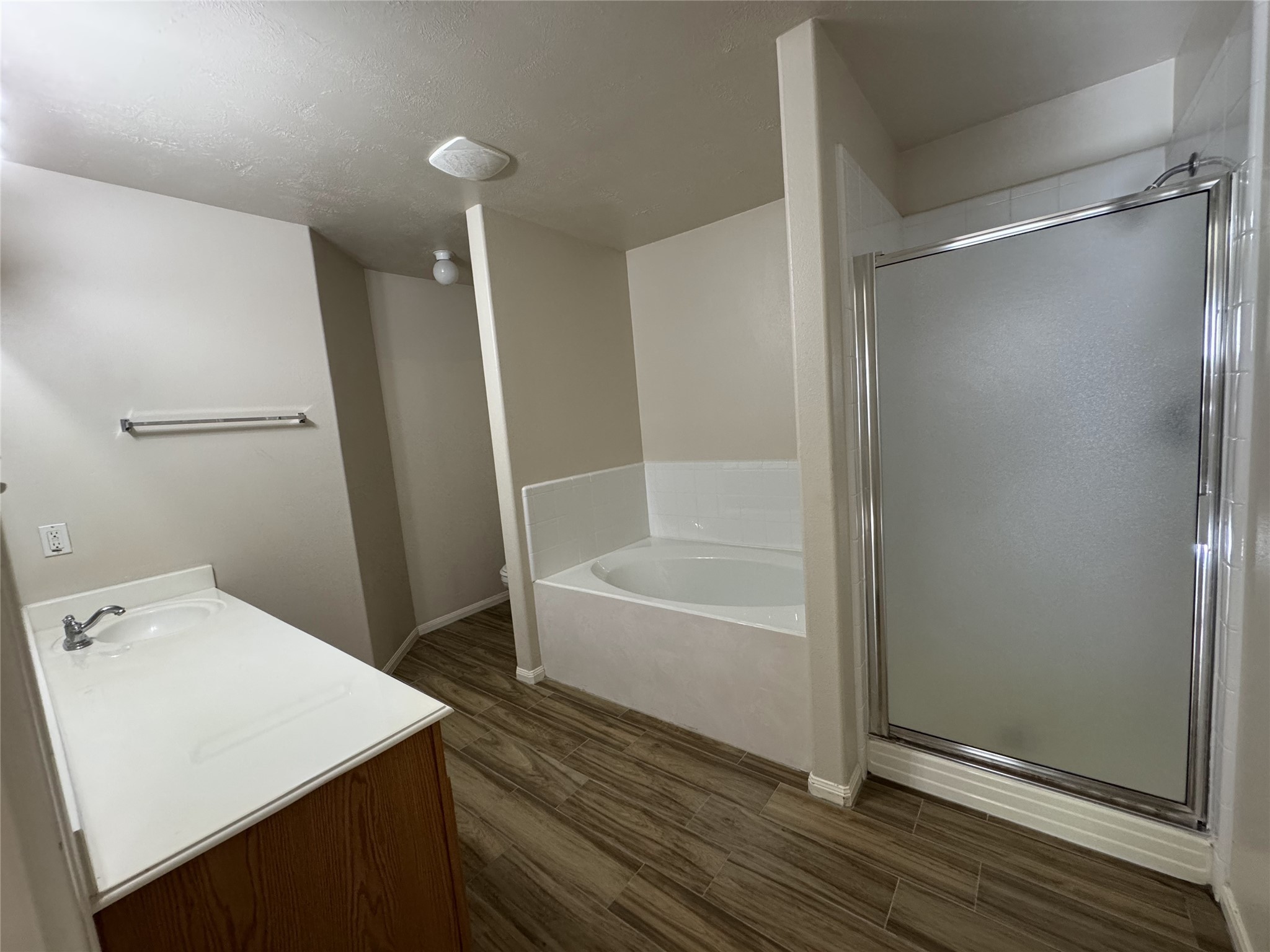 13723 Audra Lane Houston, TX 77083 - Photo 13 of 18 a bathroom with a bathtub and a shower