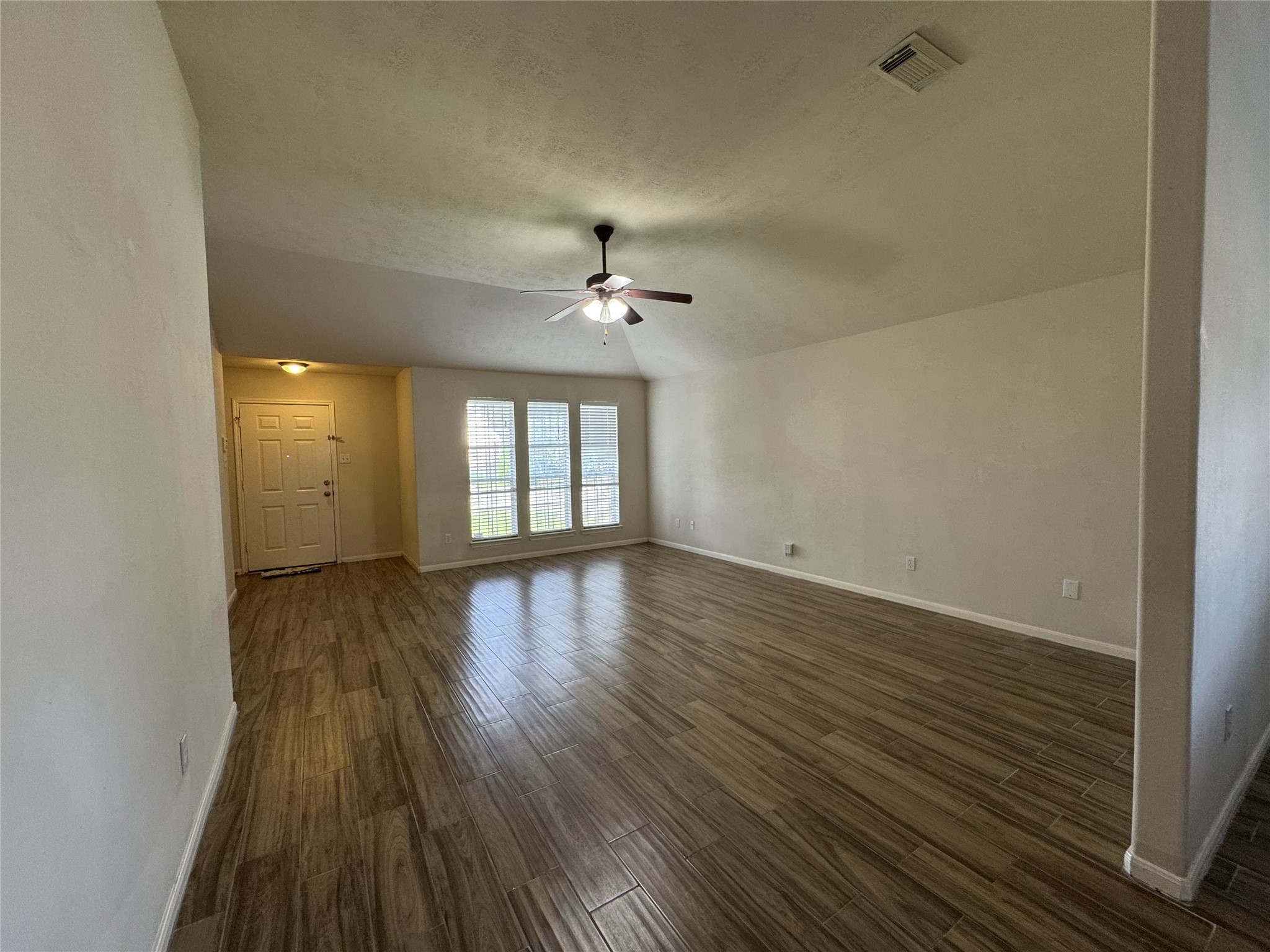 13723 Audra Lane Houston, TX 77083 - Photo 3 of 18 wooden floor in an empty room with a window