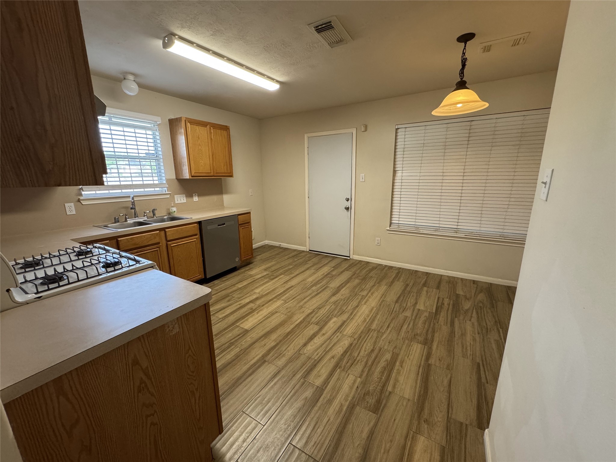 13723 Audra Lane Houston, TX 77083 - Photo 7 of 18 a kitchen with stainless steel appliances granite countertop a sink stove and refrigerator