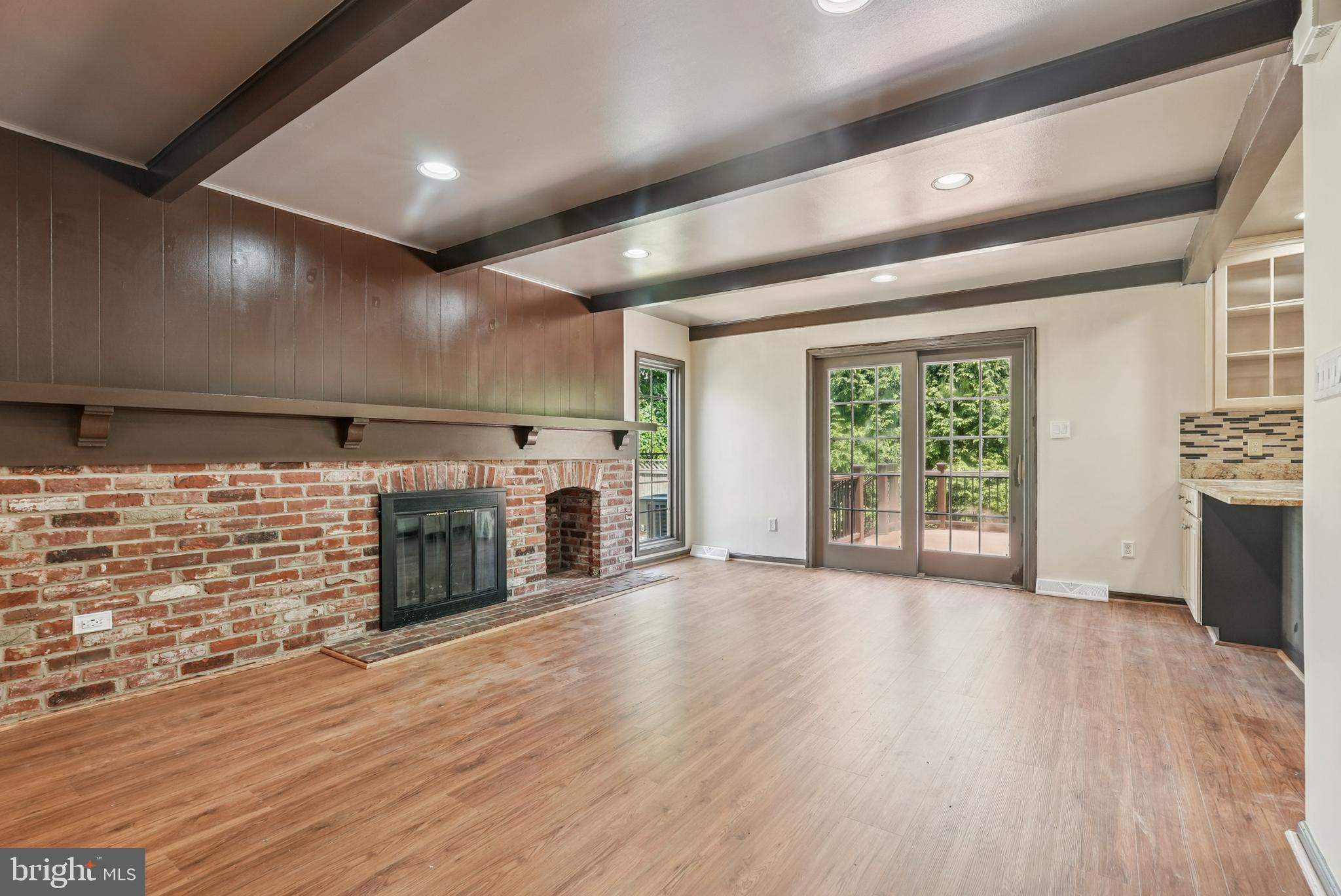 10 Rooftree Road Cherry Hill, NJ 08003 - Photo 11 of 58 a view of an empty room with wooden floor and a window
