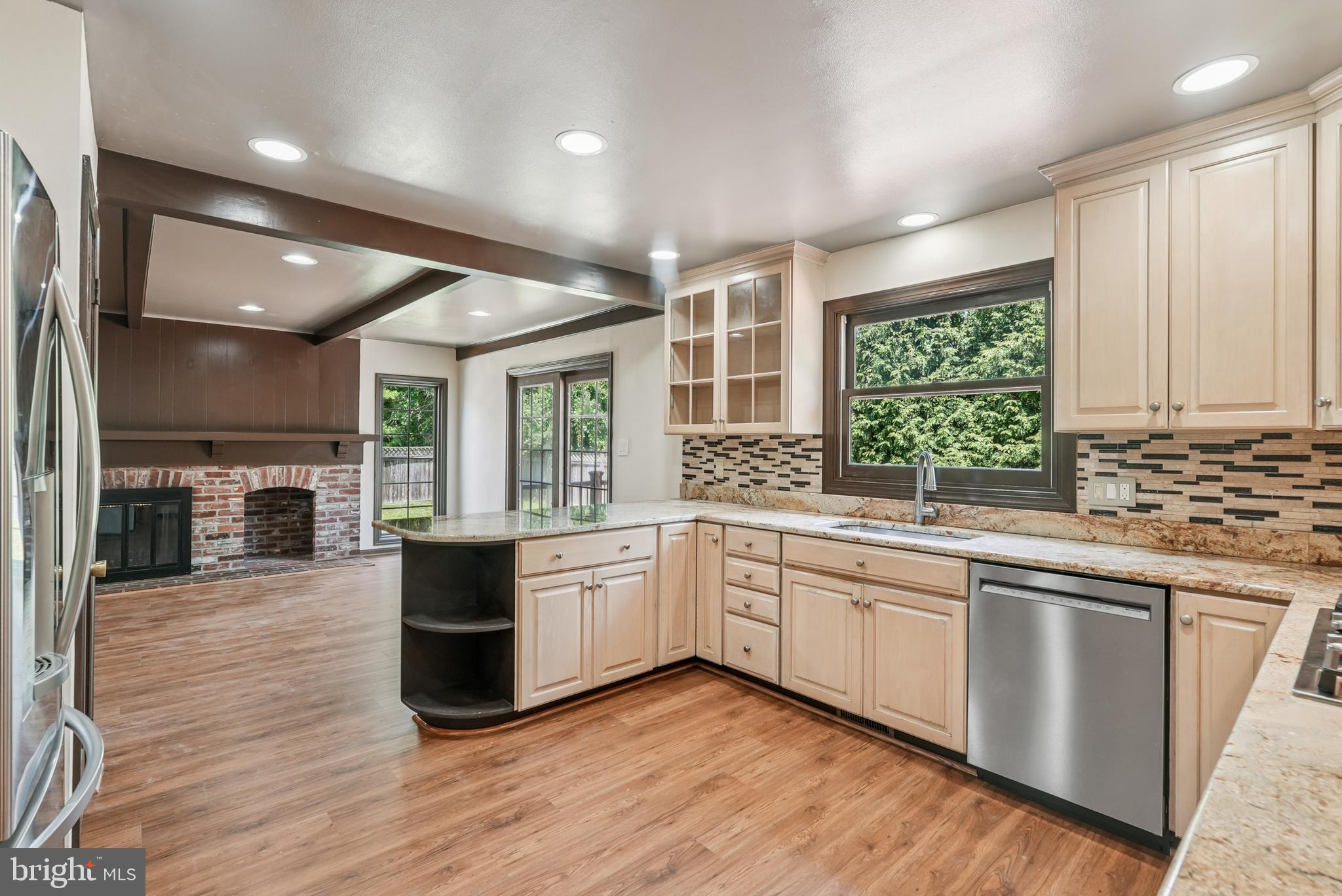 10 Rooftree Road Cherry Hill, NJ 08003 - Photo 12 of 58 a large kitchen with stainless steel appliances granite countertop a stove and a wooden floors